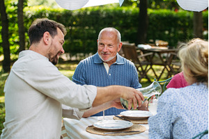 Family sharing food during garden, a Person Photo by HalfPoint