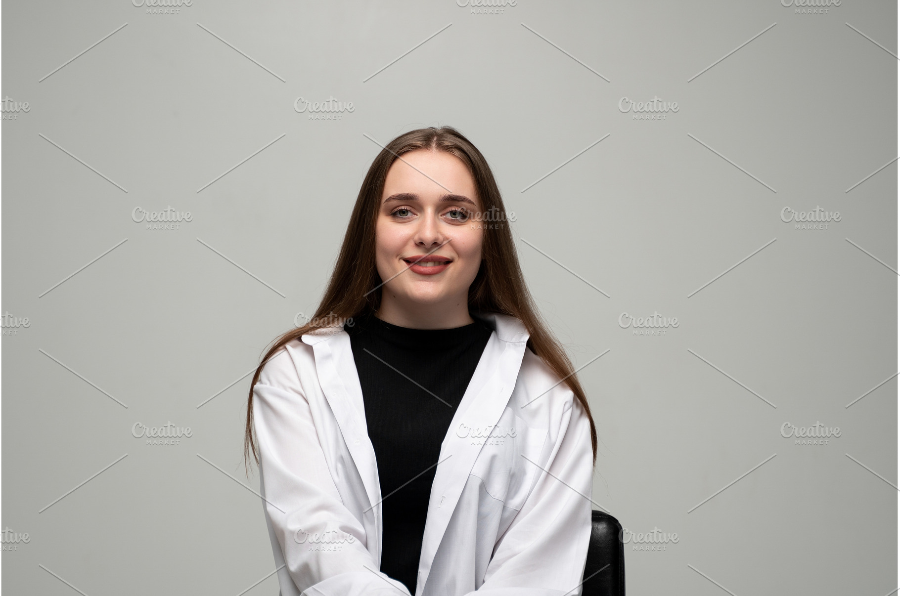 Young woman confidently smiling, a Person Photo by volodymyrshtun13795