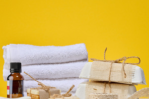 Spa and natural cosmetics items, white towels, several bars of h, a Beauty & Fashion Photo by ndanko