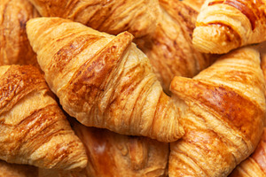Freshly baked croissants forming an appetising background for fr, a Food & Drink Photo by Olena Rudo