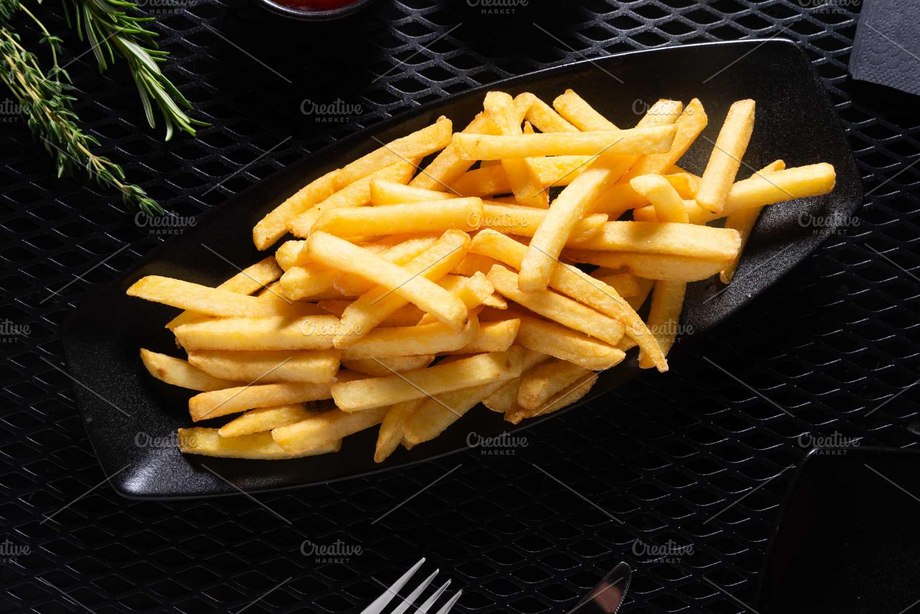 French Fries in Black Plate on Dark Table, Top View, a Photo by MDBildes