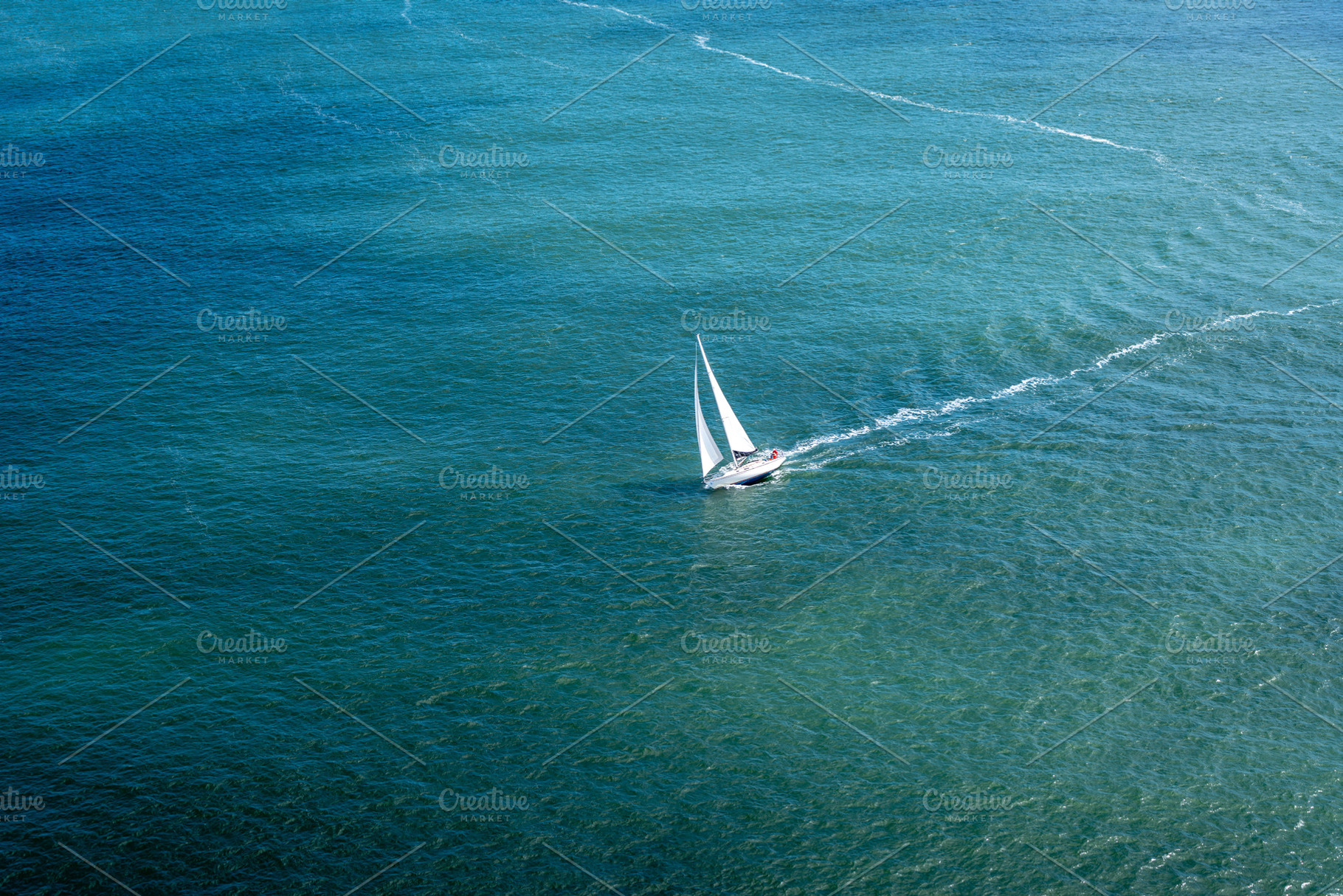 Sailboat gliding through the bay near Golden Gate Bridge, San Fr, a Transportation Photo by GoodGoods