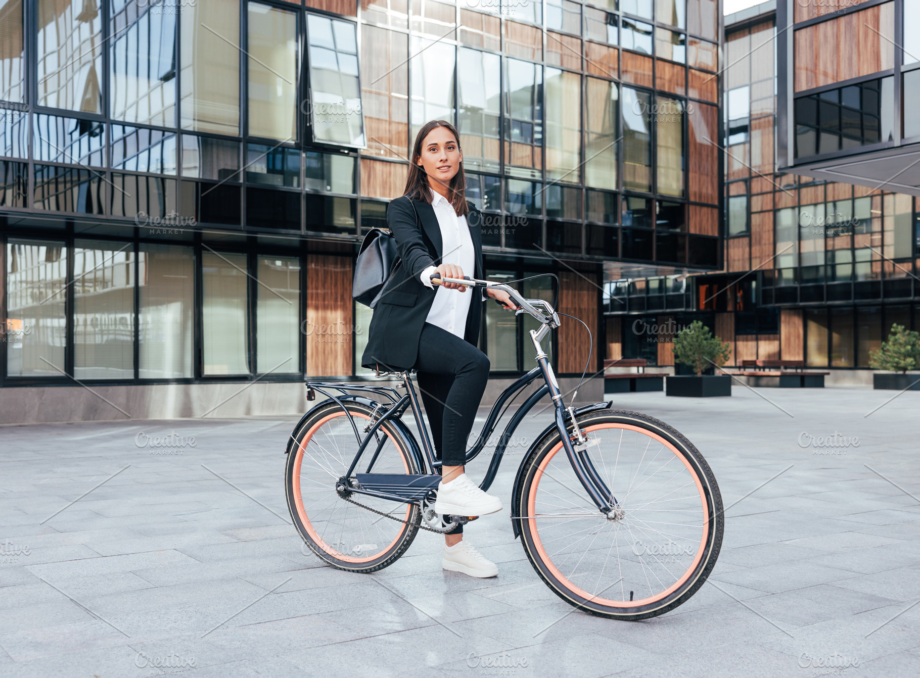 Stylish businesswoman with a bicycle, a Person Photo by Artem Varnitsin