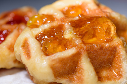 Close up fresh waffles topped with above pineapple jam