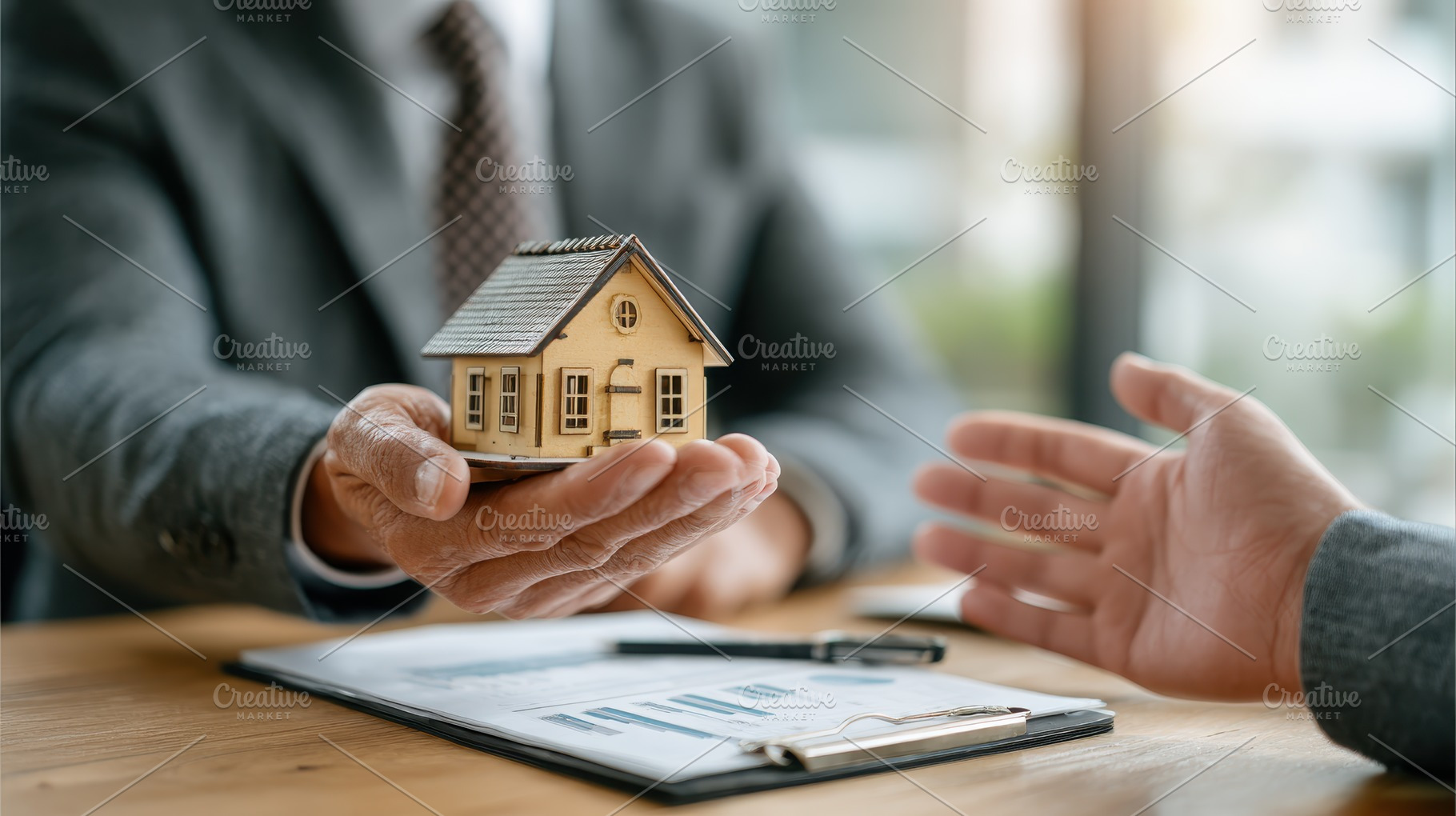 Real estate agent presenting house m, a Photo by Pixeness Studio