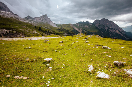 landscape with mountains, clouds, meadow, rocks and trees, a Nature Photo by Alliance Images