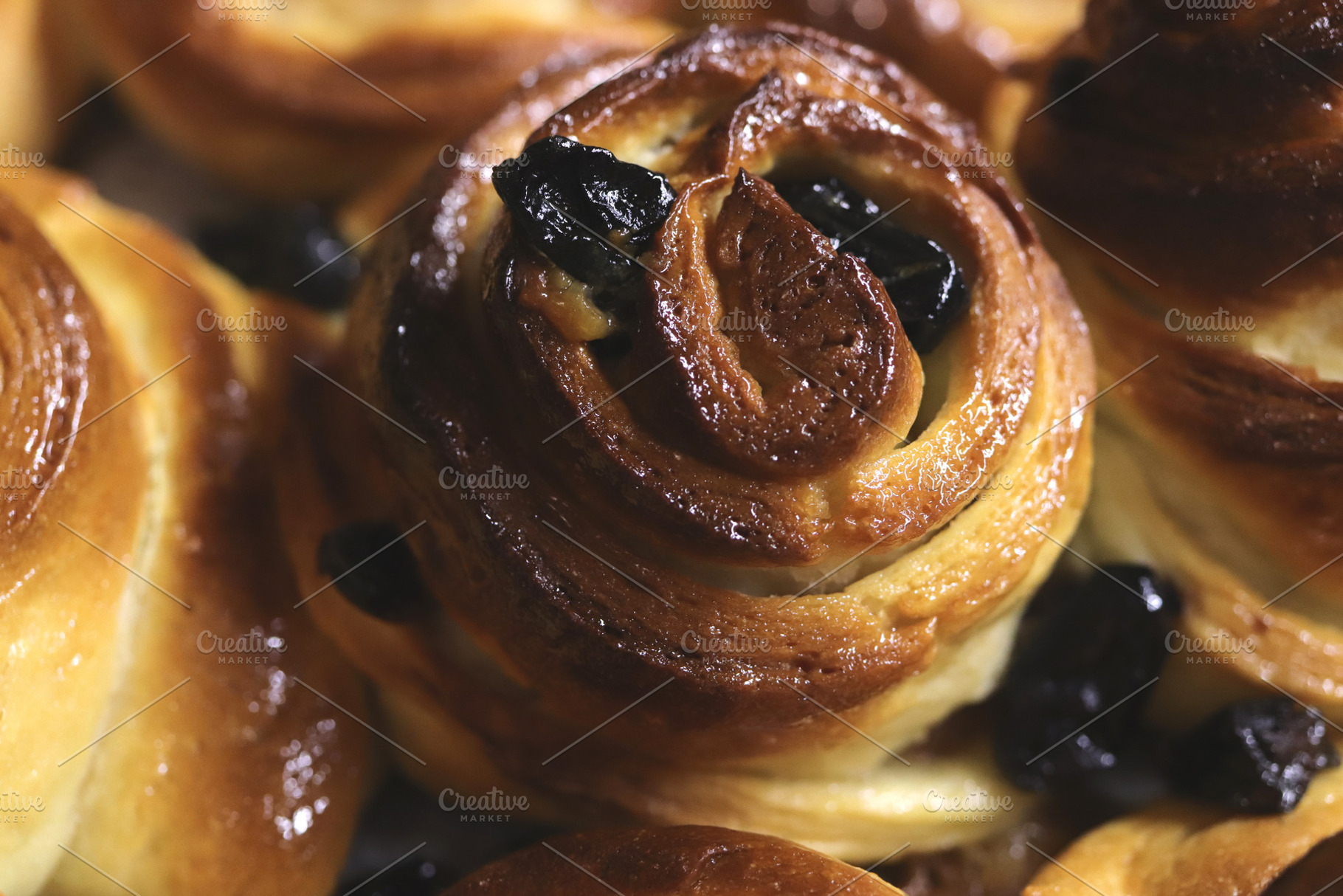 Close-up of freshly baked pastries with raisins., a Food & Drink Photo by Textures & Backgrounds