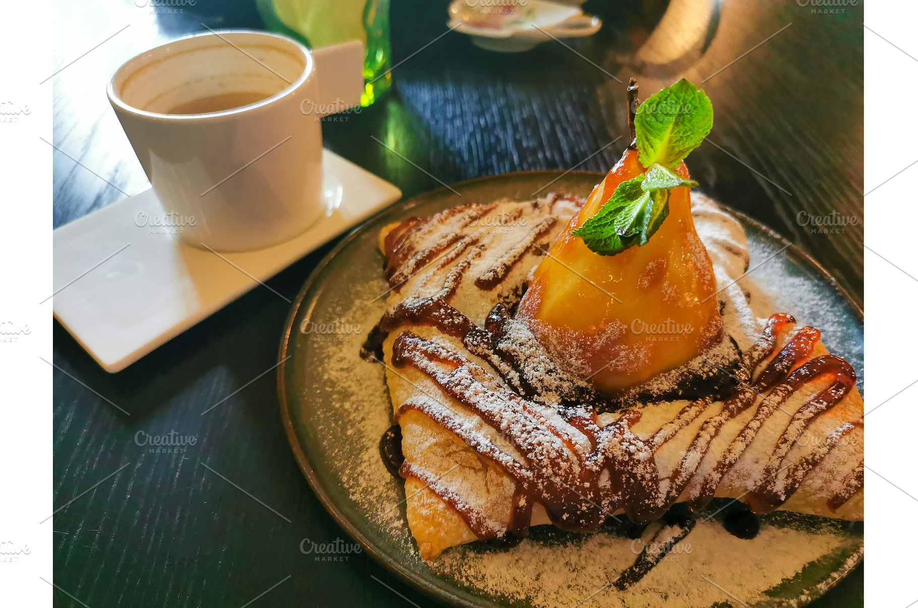 Poached pear puff pastry, cup of, a Food & Drink Photo by sceptical cactus