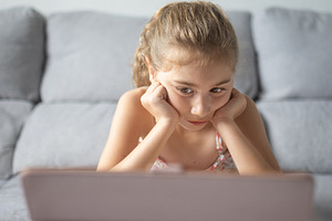 Young Girl Watching Tablet at home, a Person Photo by etorres69