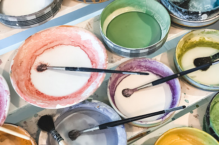 Paint brushes in colorful plates, an Arts & Entertainment Photo by Studio Light & Shade