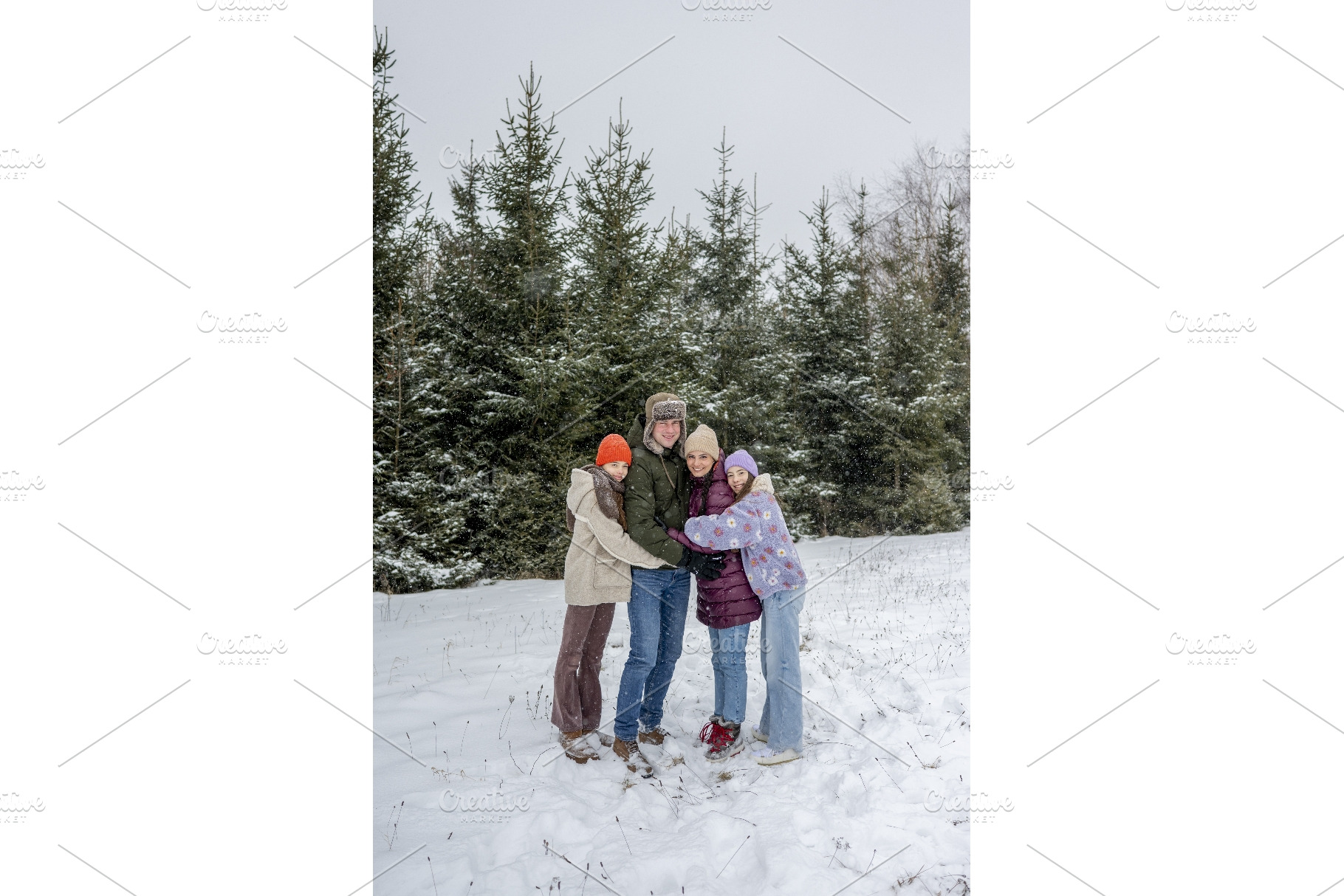 Family sharing a group hug during, a Sports & Recreation Photo by HalfPoint