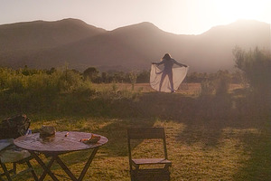 Woman in nature at sunrise expressing freedom, a Person Photo by DanFLCreativo