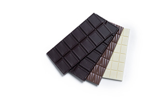 Assortment of white, milk and dark chocolate pieces, a Food & Drink Photo by etorres69
