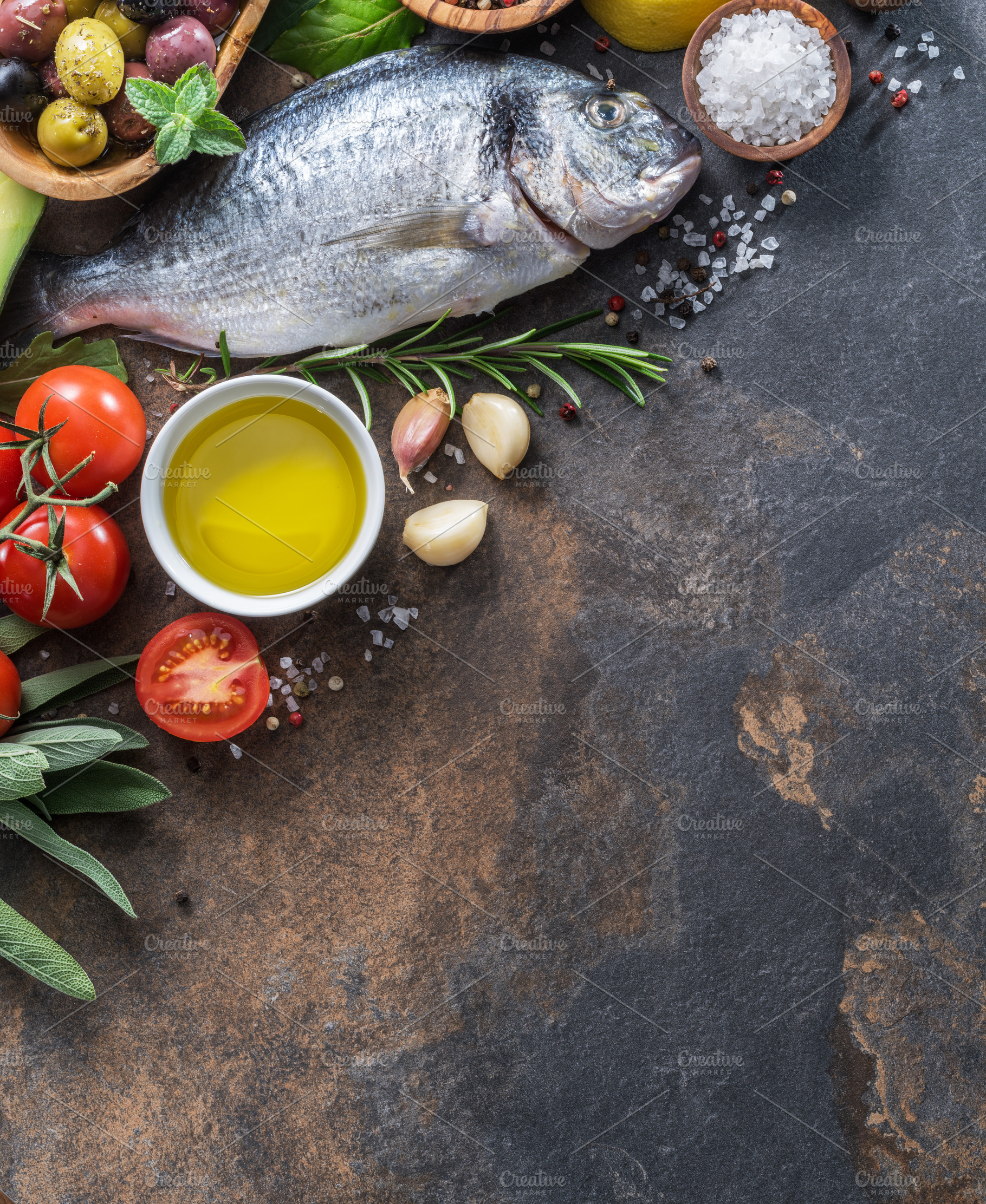 Raw dorado fish with spices and vege, a Food & Drink Photo by Volff