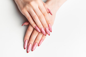Female hands showing long pink glitter stiletto nails, a Beauty & Fashion Photo by Olena Rudo
