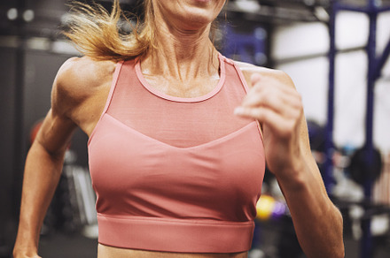 Smiling mature woman running on a treadmill in a gym, a Sports & Recreation Photo by Stefan & Janni