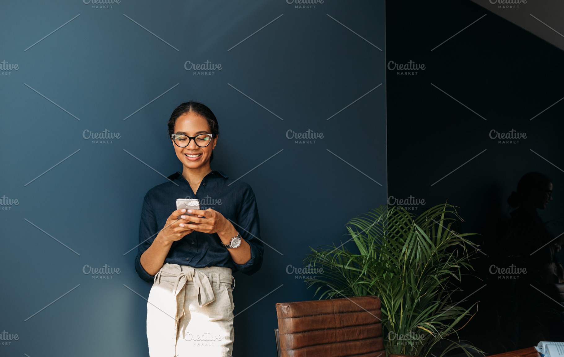 Smiling businesswoman typing, a Business Photo by Artem Varnitsin