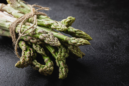 Green asparagus on a black table