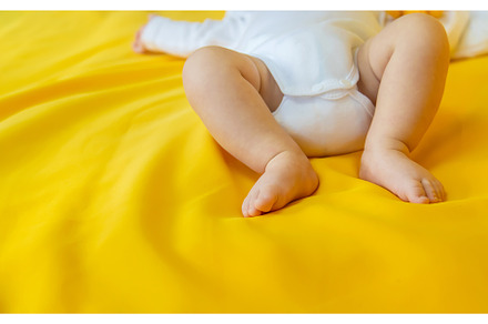 Baby feet on a yellow background, a Person Photo by yanadjana