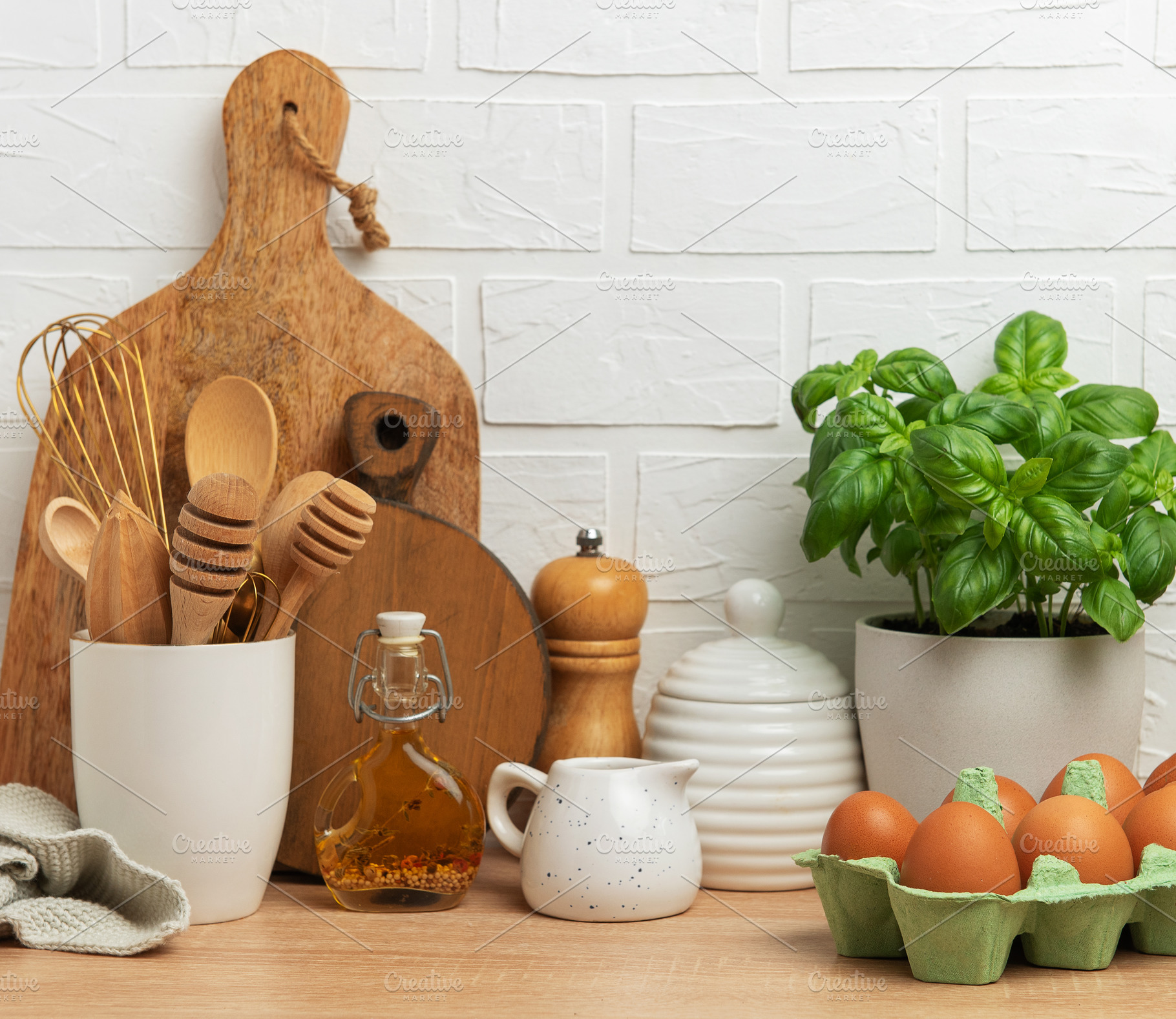 Kitchen utensils, fresh eggs, basil plant and olive oil creating, a Food & Drink Photo by Olena Rudo