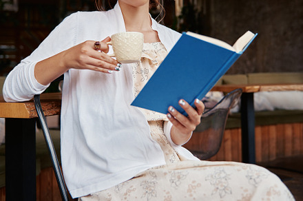 Lovely girl in restaurant with book, a Person Photo by Jetrel