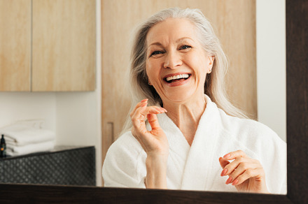 Happy mature woman with grey hair, a Person Photo by Artem Varnitsin
