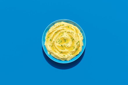 Mashed potatoes above view on a blue background, a Food & Drink Photo by YesPhotographers