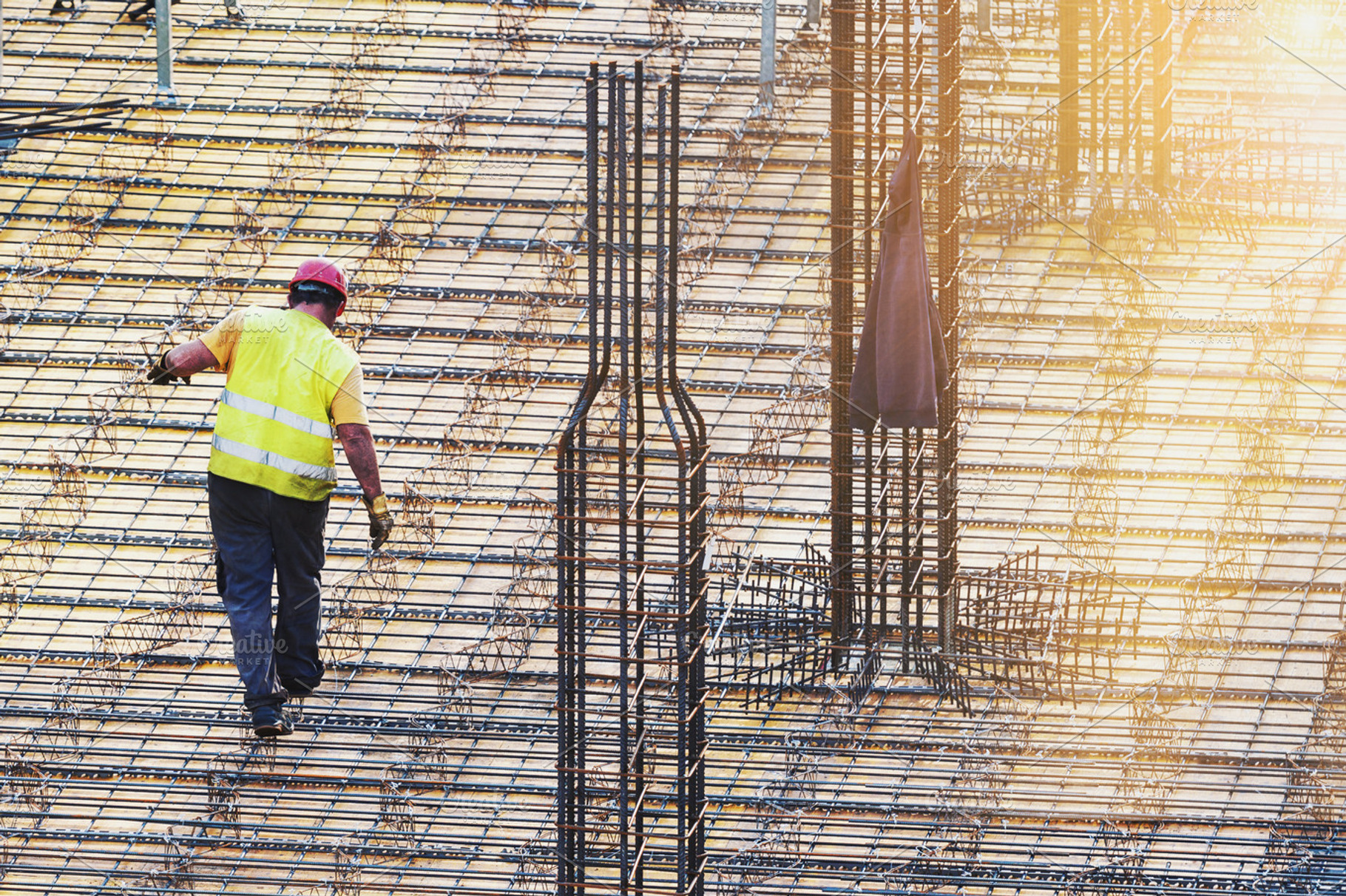 Worker at construction site, an Industrial Photo by BOOCYS