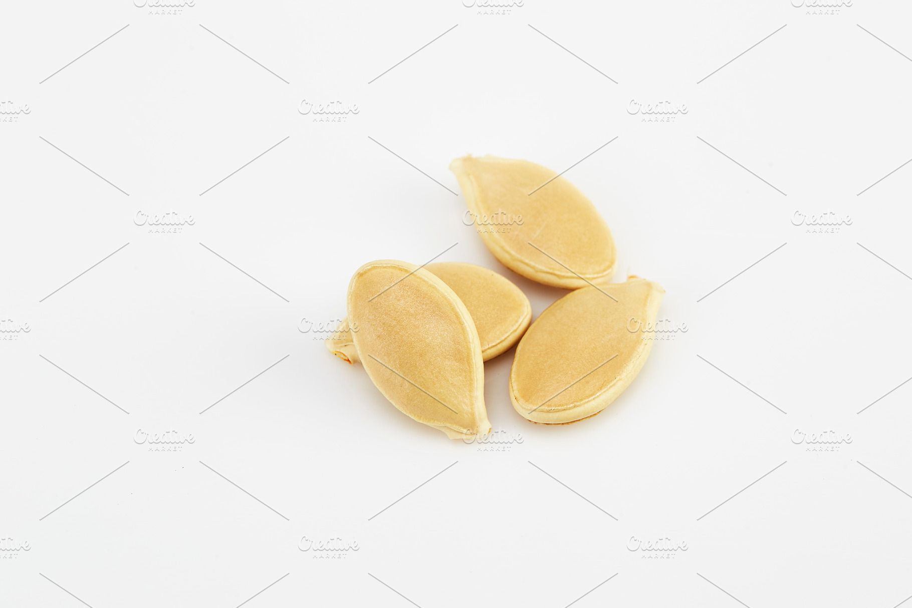 Pumpkin seeds on the white, a Background Photo by 1981 Rustic studio kan