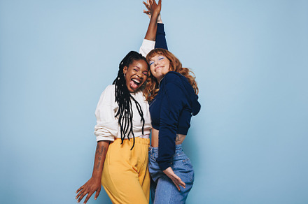 Two best friends dancing together