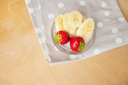 strawberry and banana on a glass plate on a wooden background, a Food & Drink Photo by Artsaba Family