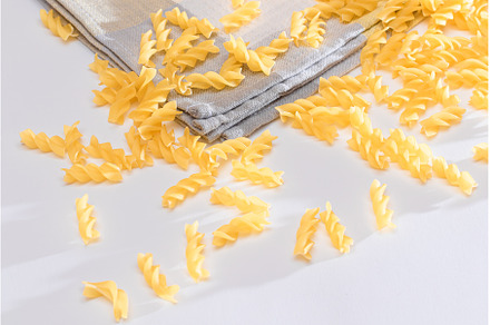 Uncooked Fusilli Pasta Scattered on, a Food & Drink Photo by InfinitumProdux