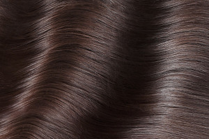 A closeup view of a bunch of shiny featuring hair, color, and salon