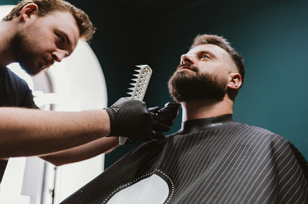 Hairdresser beard shaping, professional barber trimming and comb, a Person Photo by progressman