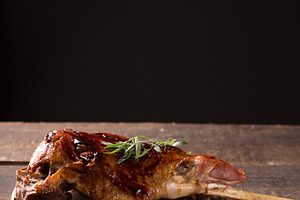 Roasted lamb leg stock photo containing animal and bone