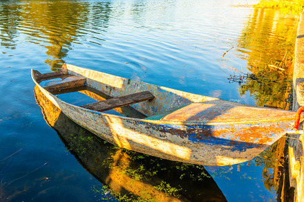 Wooden old fishing boat on river, a Nature Photo by Vapi