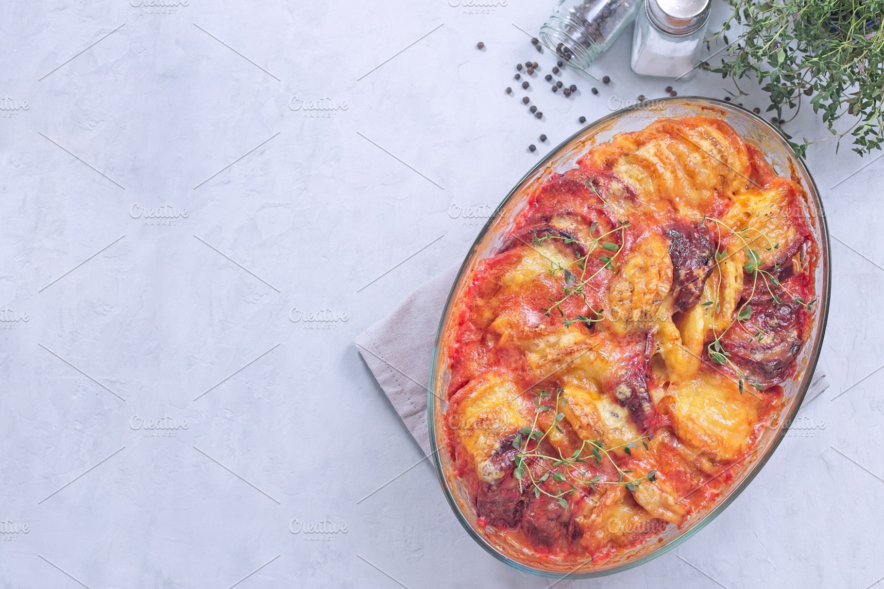 Gratin with sweet potato, parsnips, beet root and melted cheese, horizontal top, a Food & Drink Photo by iuliia_n