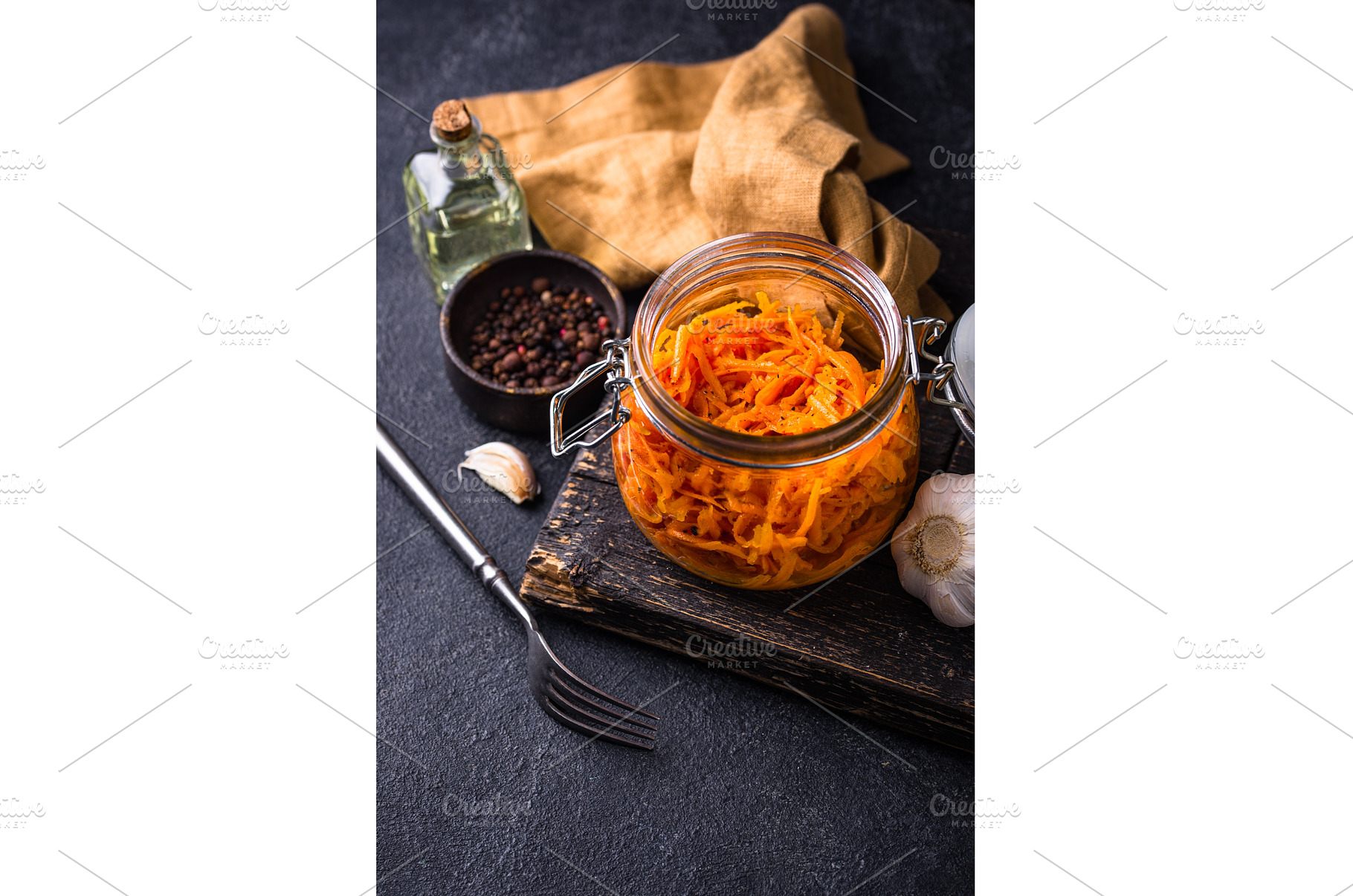 Spicy korean carrot salad in jar, a Food & Drink Photo by Yulia Furman