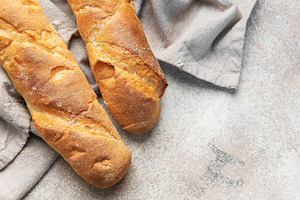 Fresh crisp baguettes on rustic linen cloth, a Food & Drink Photo by Olena Rudo