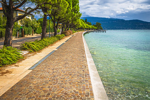 Waterfront walkway and Lake Garda, a Nature Photo by Alpine Dreams
