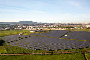 Solar energy farm captures sunlight in rural setting with mountains in the back, a Photo by andreonegin market