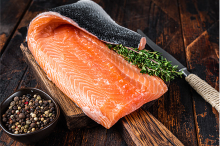 Salmon fillet fish on a wooden board, a Food & Drink Photo by composter-box@mail.ru