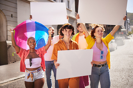 Poster mockup, lgbt protest and people walking in city street for activism, human rights and equality. Freedom, diversity and lgbtq community crowd with mockup billboard space for social movement, a Photo by Peopleimages.com