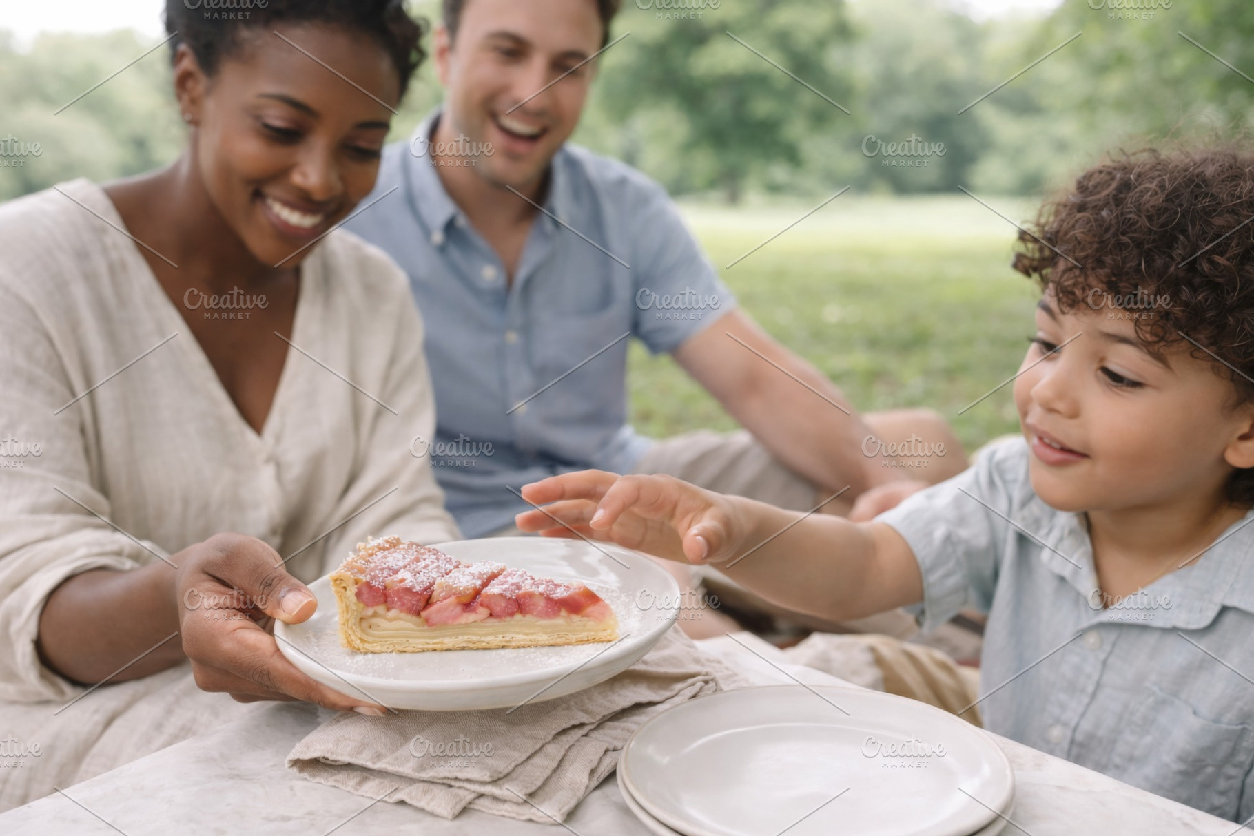 Family enjoying rhubarb pie during p, a Photo by Dvoevnore photos