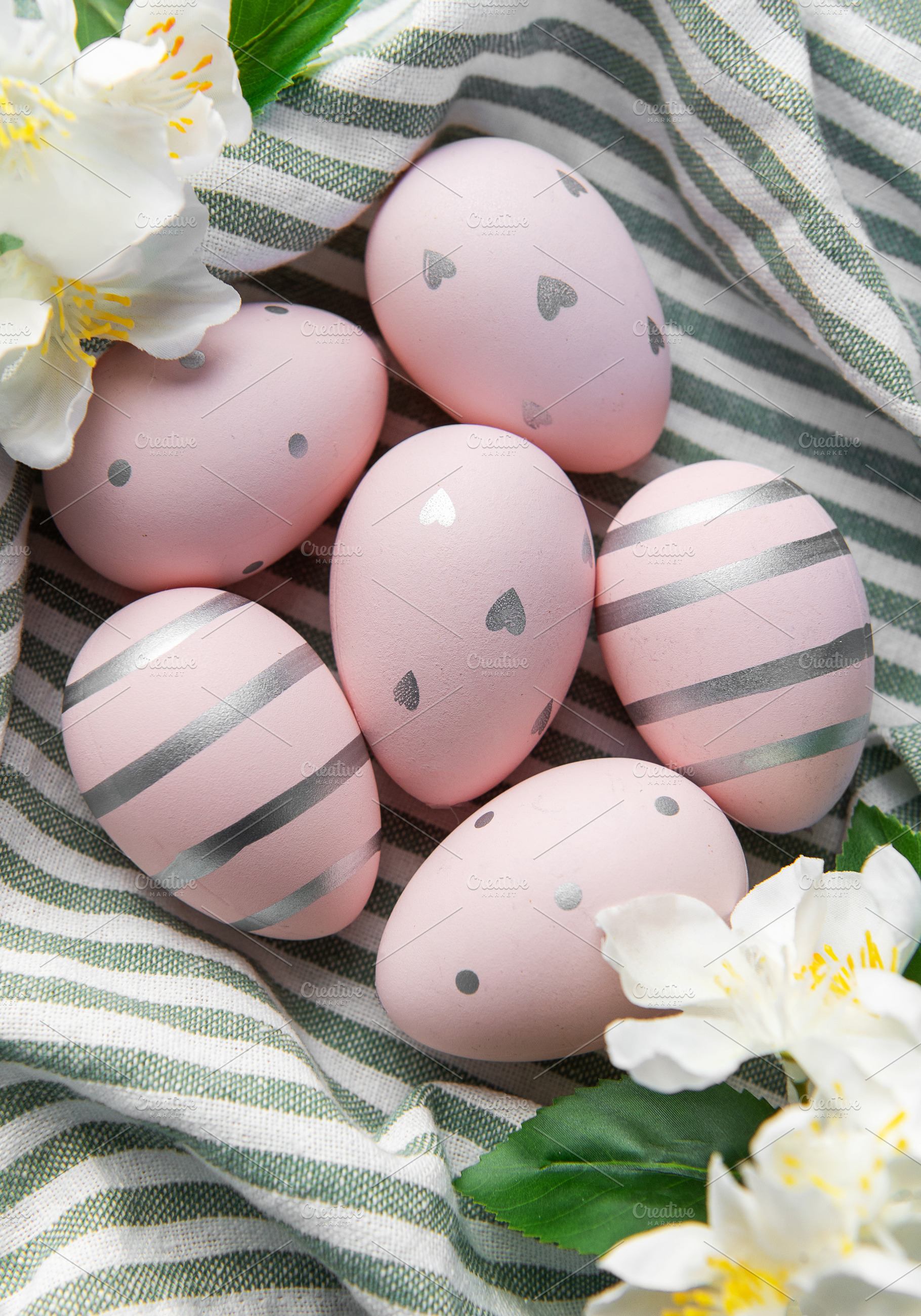 Pink easter eggs with silver patterns and spring flowers, a Holiday Photo by Olena Rudo