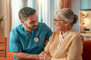 Nurse helping an elderly person at home, a Healthcare Illustration by DanFLCreativo