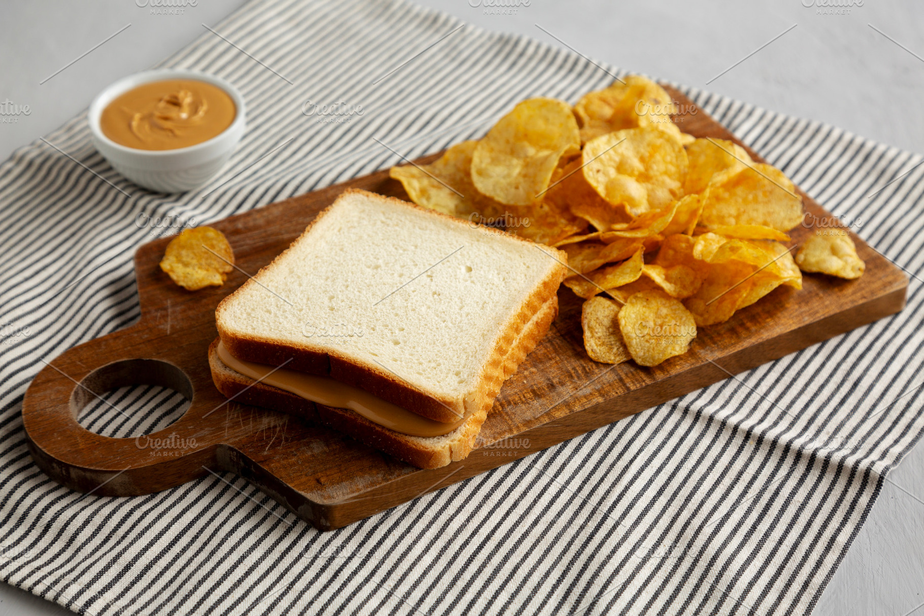 Homemade American Peanut Butter Sandwich on a Wooden Board, side, a Food & Drink Photo by LiudmylaChuhunova