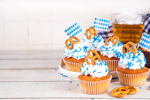 Oktoberfest cupcakes with pretzel and colorful sugar sprinkles, a Food & Drink Photo by Rimma