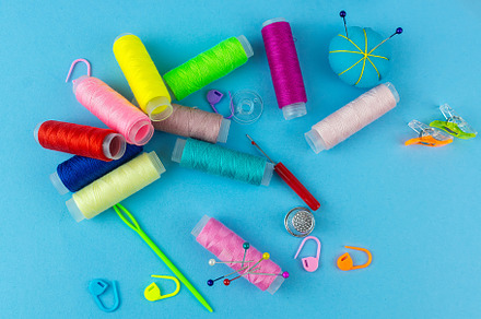 Sewing accessories on a blue bed bac, an Industrial Photo by AlexBush