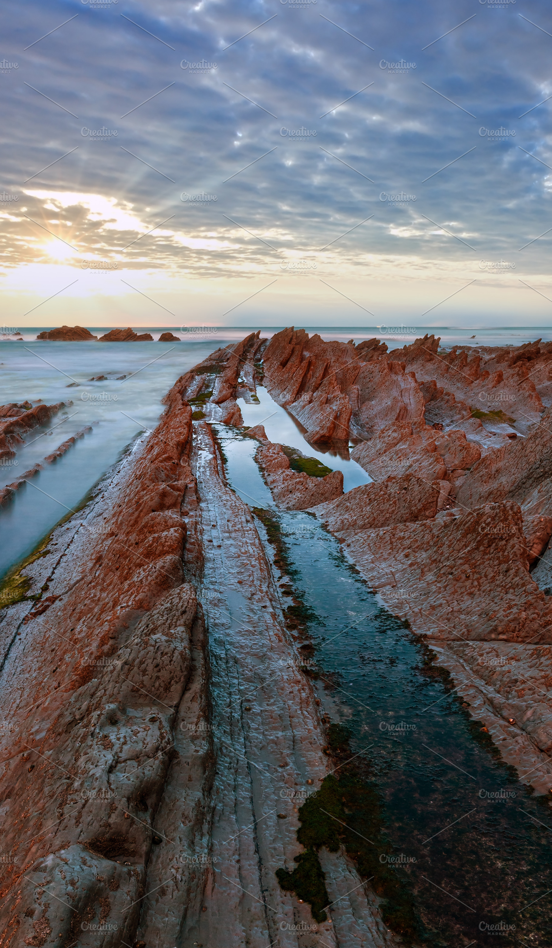 Twilight ocean coast with ribbed stratiform rock., a Nature Photo by YuriyB